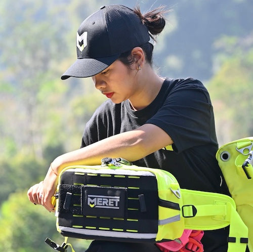 M BADGE SNAPBACK TRUCKER HAT