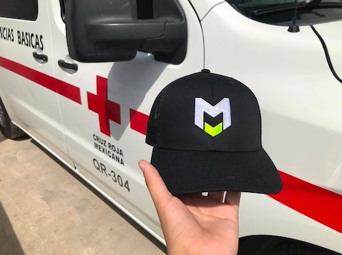 M BADGE SNAPBACK TRUCKER HAT
